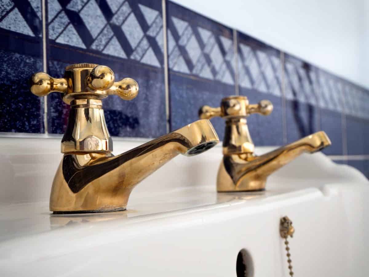 closeup golden traditional bathroom two tap holes wash sink basin