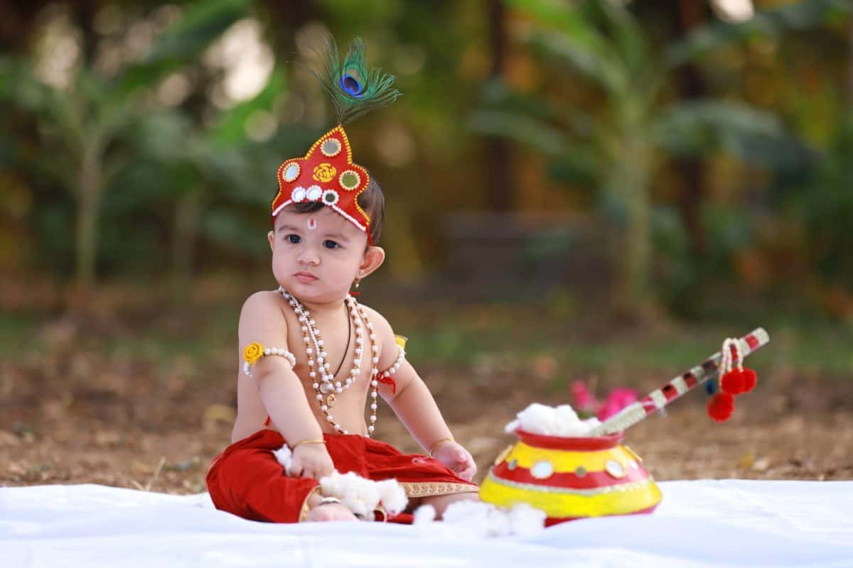 Adorable baby boy dressed up as Little Krishna in India