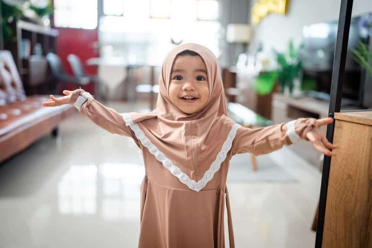 Cute Muslim toddler girl ini hijab at home