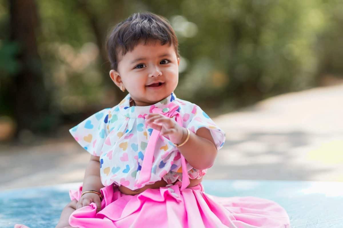 Indian baby girl smiling and giving expression.