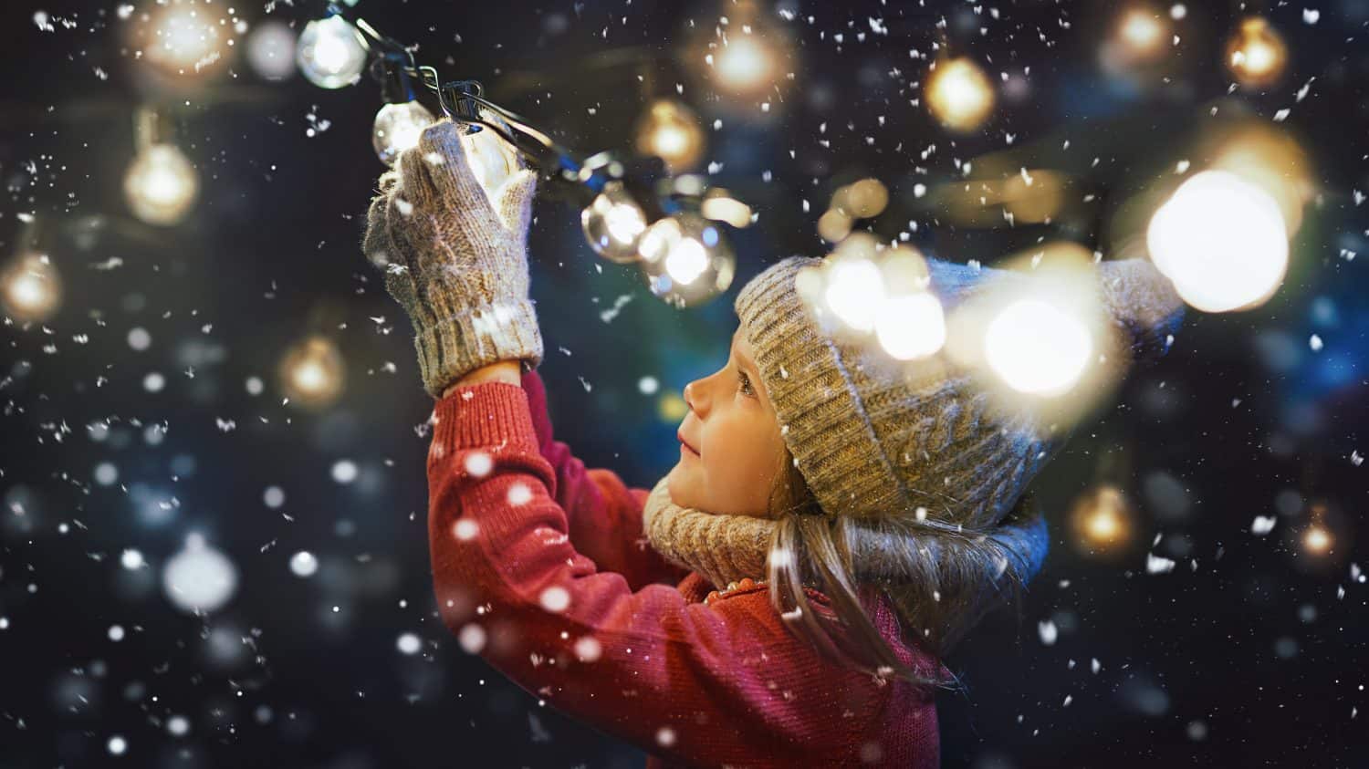 Cute girl enjoying the holidays at Christmas. Decorate feast.