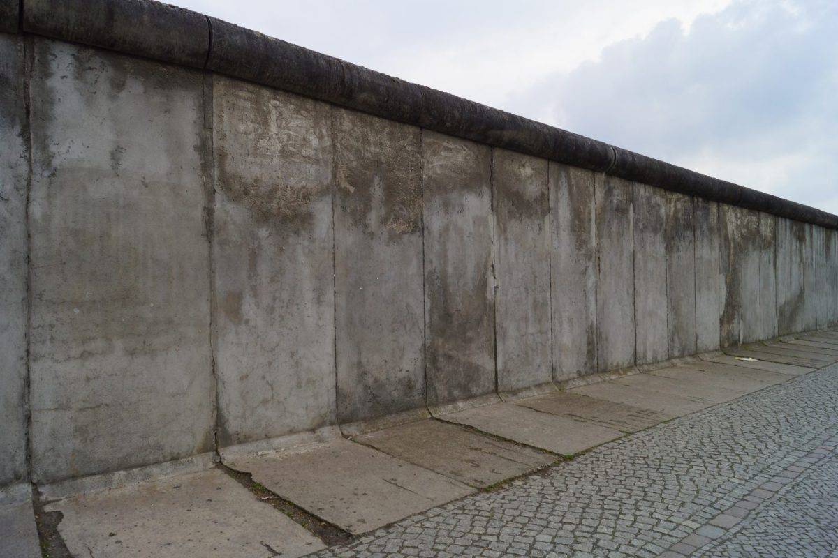 A powerful symbol of the Cold War, the Berlin Wall divided a city and a nation. This stock photo captures its iconic presence and historical significance