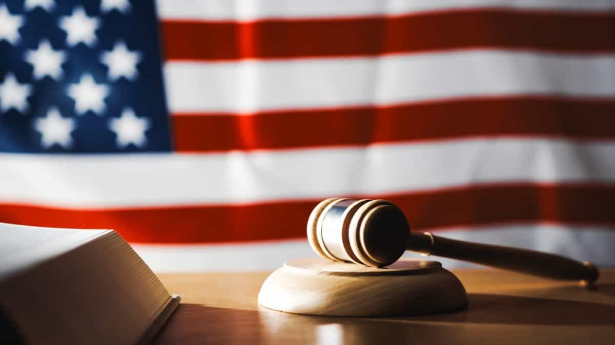 U.S. Supreme Court with gavel on a book and U.S. flag