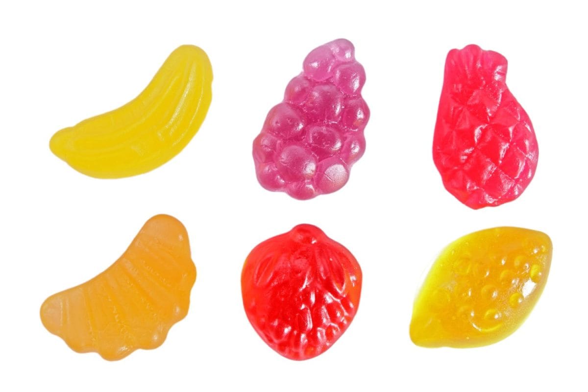 Fruit gummi candies assortment on white