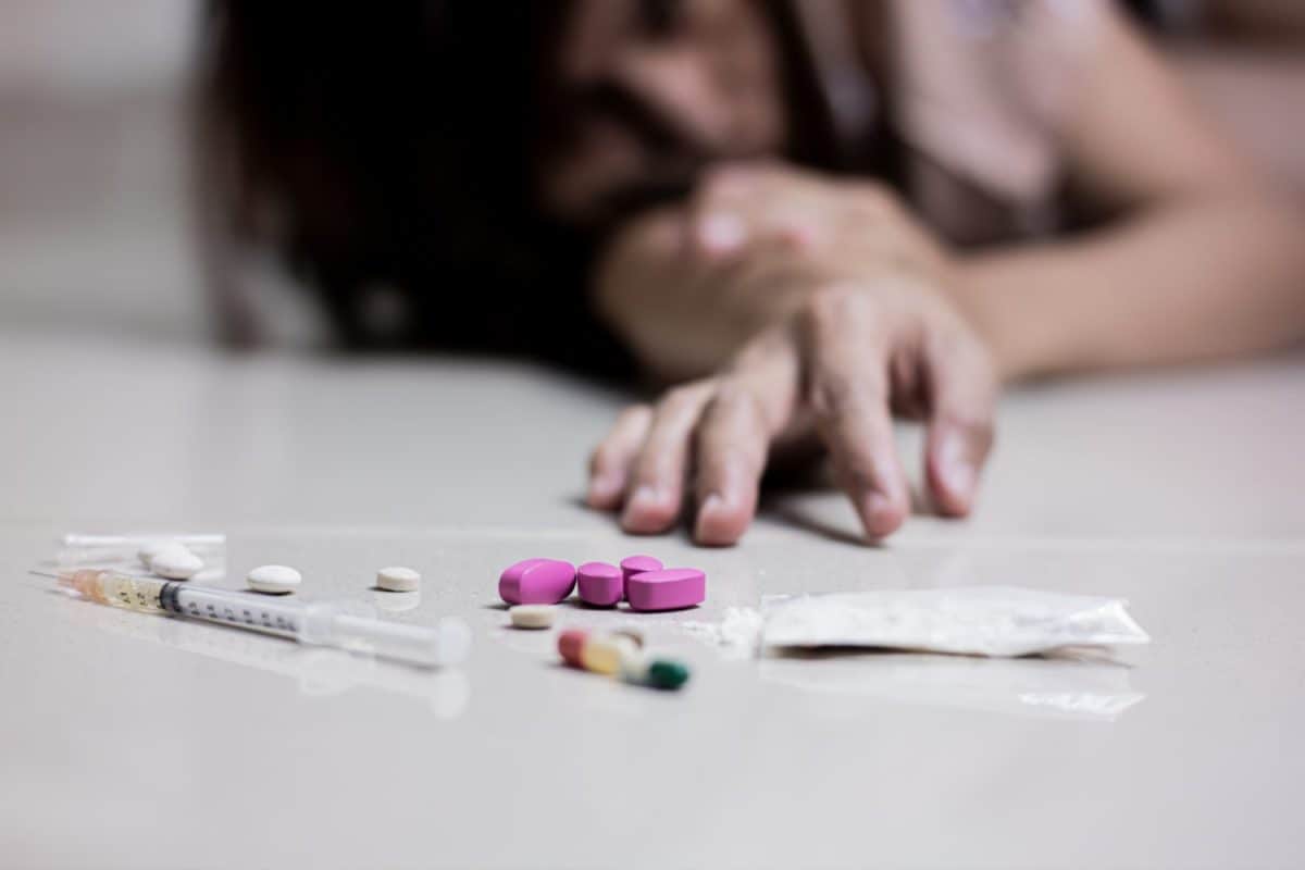 a young woman feels devastated and frustrated after using methamphetamine, syringes and pills. The concept for drugs addiction, International Day against Drug Abuse. say no to drugs. Signs It May Be Time for a Divorce