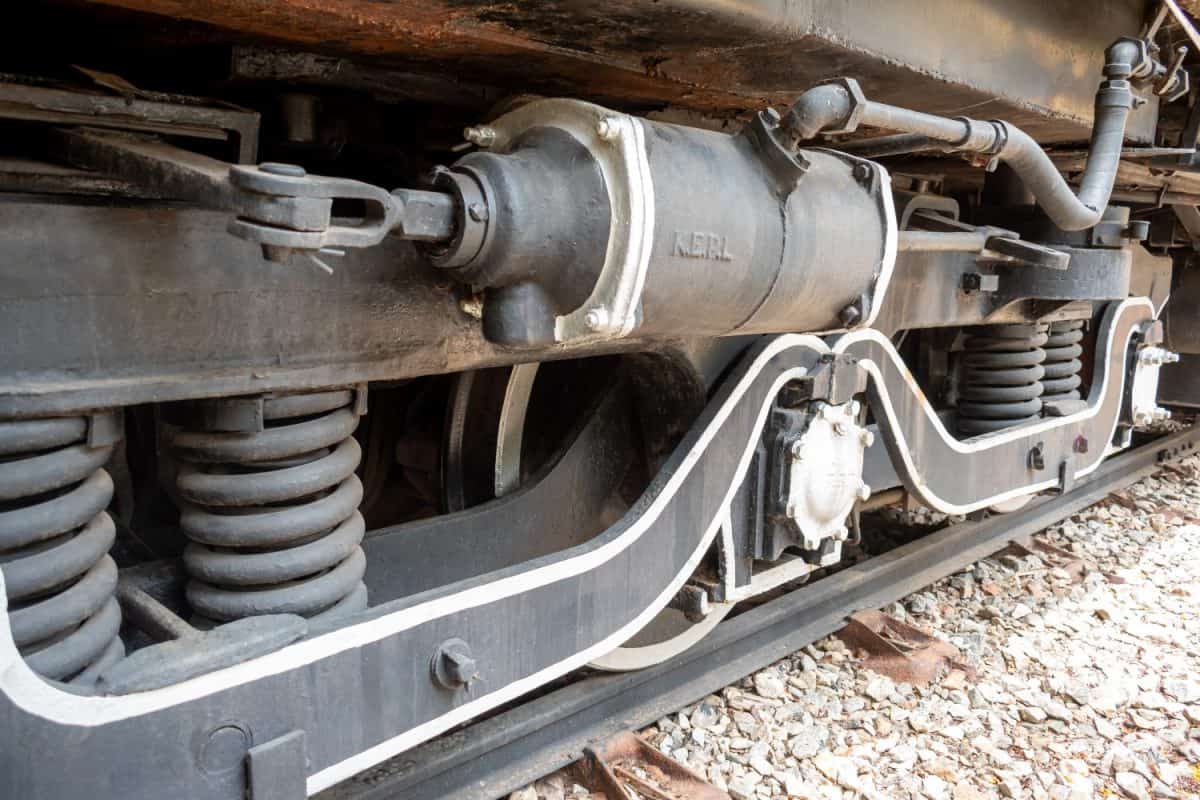 A perspective of steam locomotive wheels. train wheels on rails. Vintage train engine. diesel electric locomotive. Closeup of heavy machinery. Industrial revolution and progress in world economy.