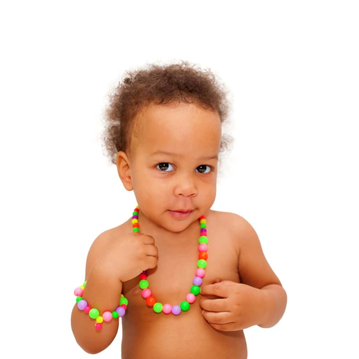 Black baby wearing a beads and a bracelet. Isolated on white background.