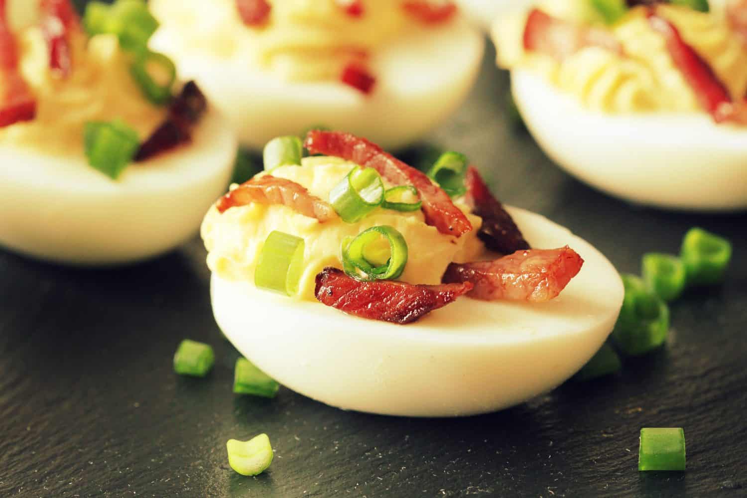 Bacon Deviled Eggs on black background