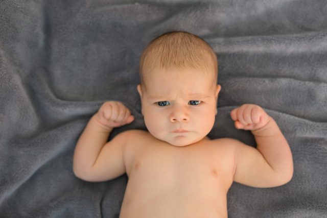 Baby showing his muscles