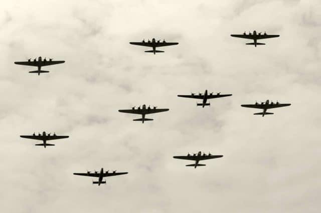 Featured image for the 10 Shortest Wars article. Group of World War II heavy bombers on a mission