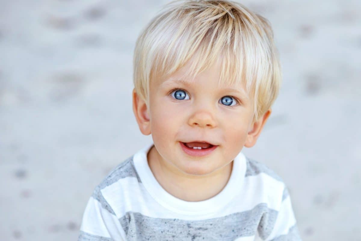 Cute boy with blond hair and blue eyes