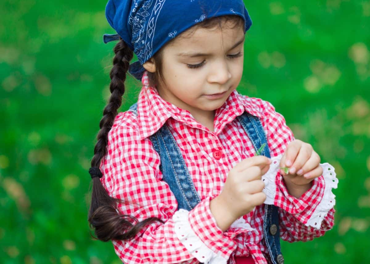 portrait of an Armenian child on green grass