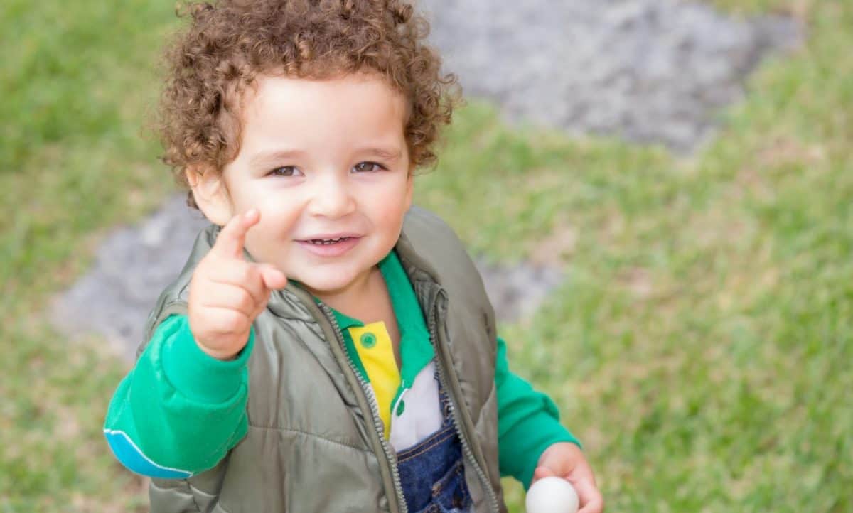 Baby Boy smiling and pointing to the camera