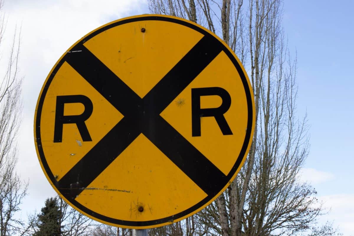 Close up photo of yellow Railroad traffic sign