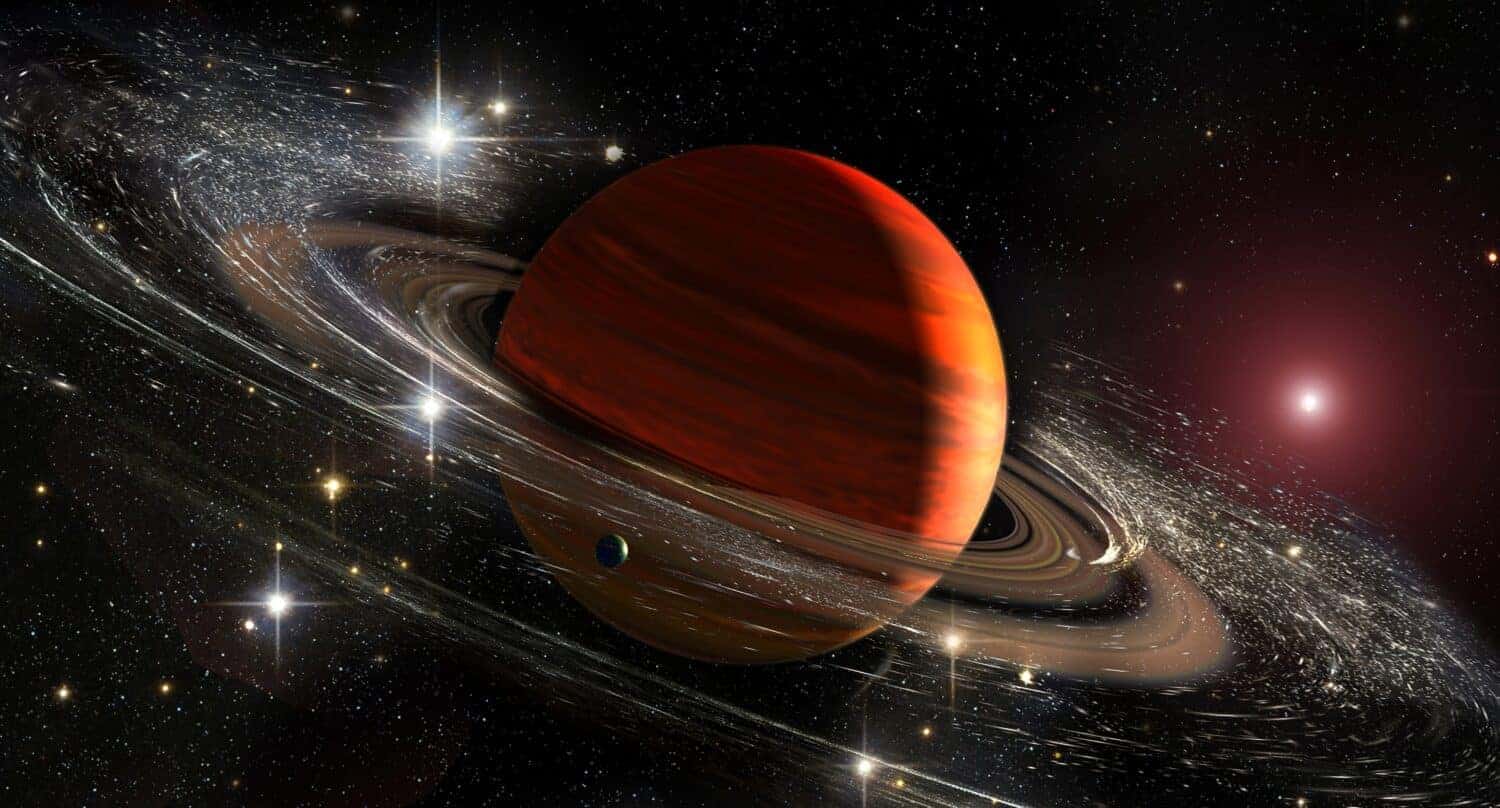 Saturn planet with rings in outer space among star dust and srars. Titan moon seen. Elements of this image furnished by NASA.