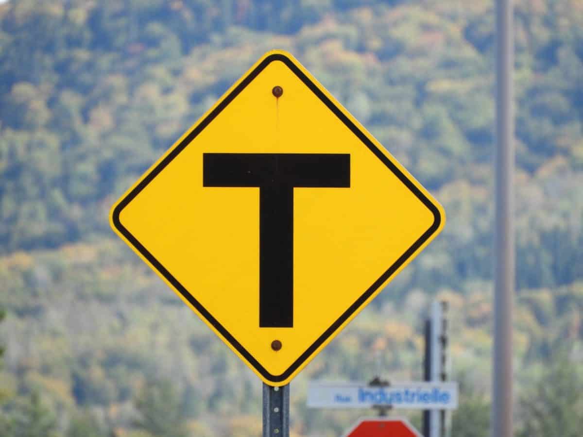 T intersection ahead yellow road sign