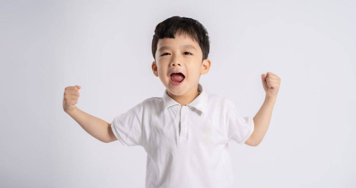 Portrait of asian boy posing on white background