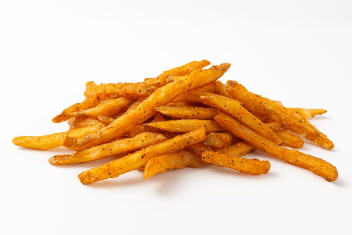 Cajun French fries on a white background