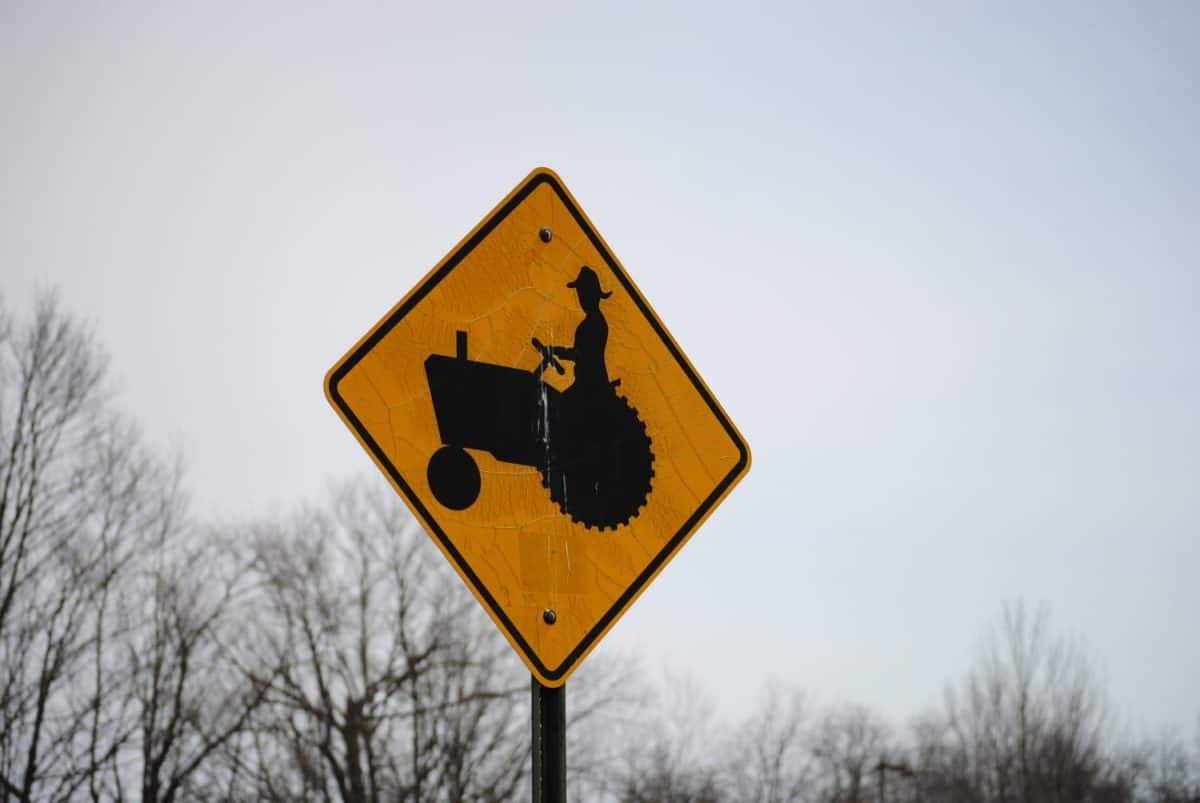 A tractor crossing road sign