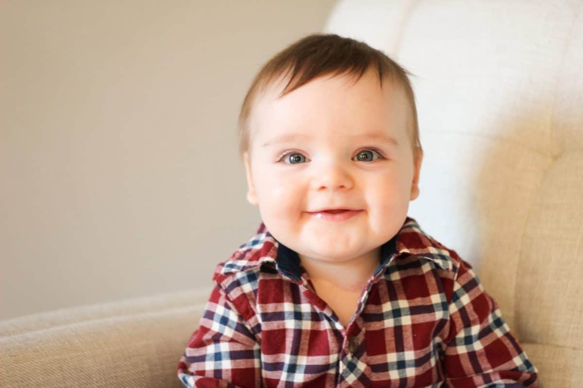 Portrait of infant boy with plaid shirt