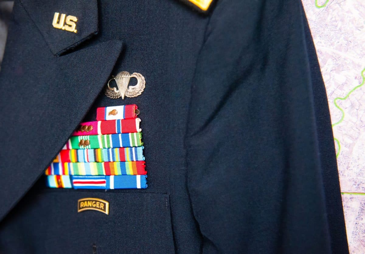 us army dress uniform in front of a map