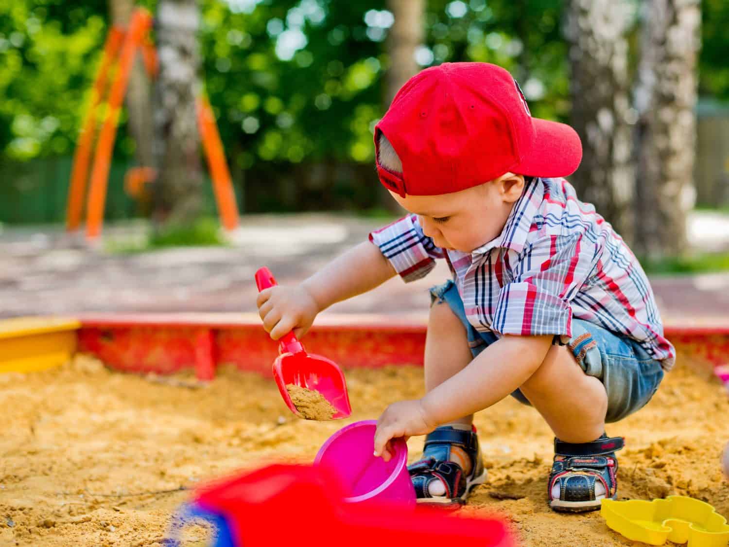 child plays with sand