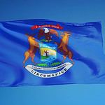 A Blue Flag with a Coat of Arms Representing the State Seal