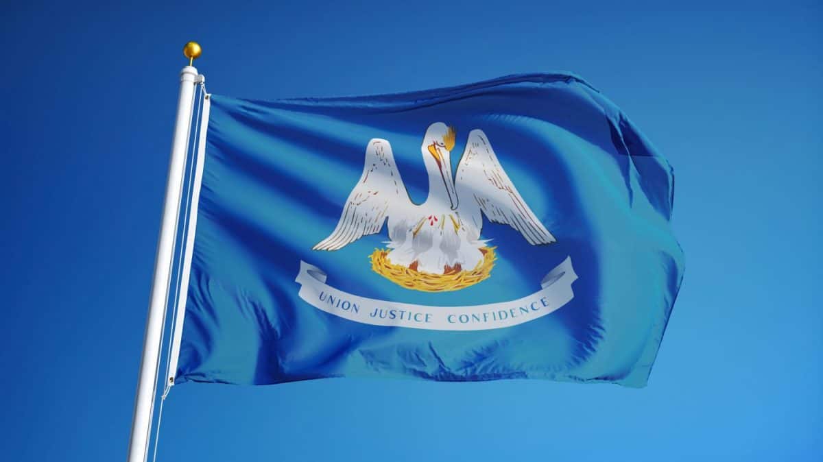 Louisiana (U.S. state) flag waving against clear blue sky, close up, isolated with clipping path mask alpha channel transparency, perfect for film, news, composition