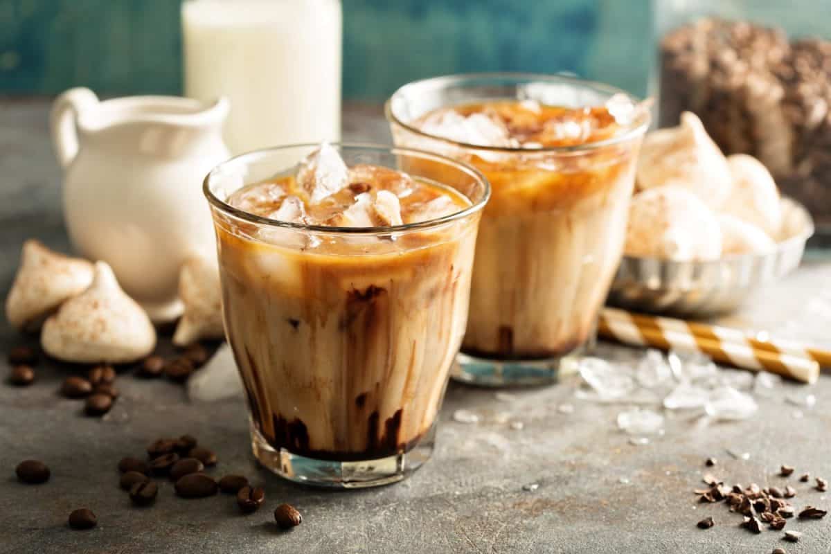 Iced coffee with milk, chocolate syrup and meringues.