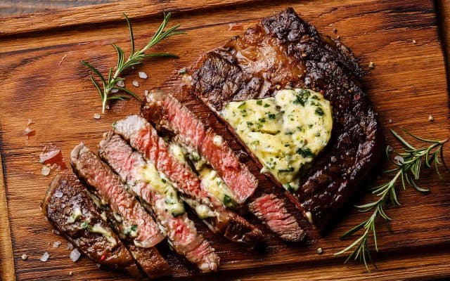 Sliced grilled steak Ribeye with herb butter