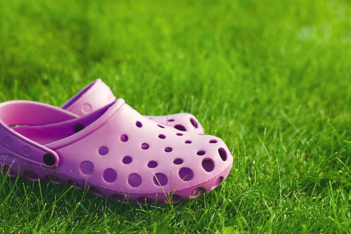 pink flip-flops on the lawn. Forget Crocs, Here's 8 Better Options for Your Feet