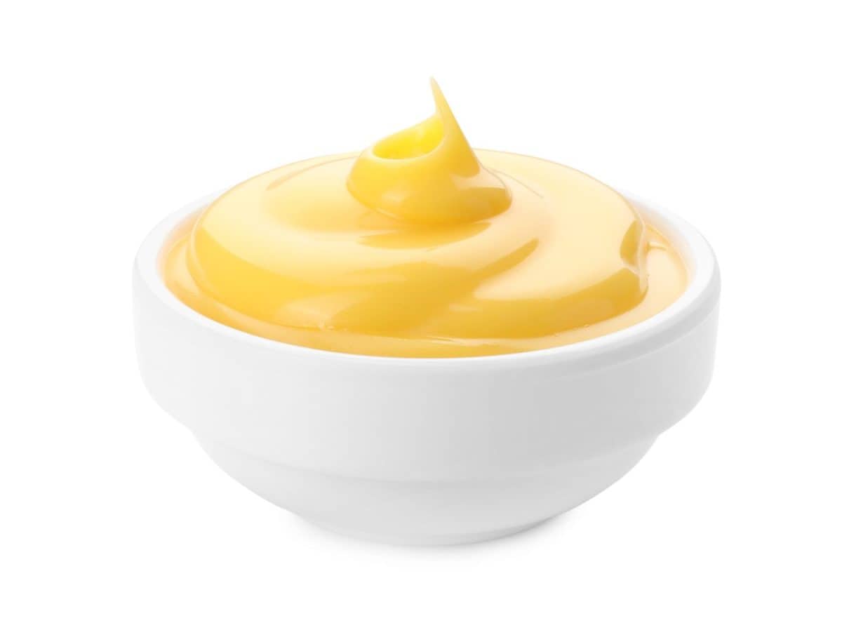 Delicious cheese sauce in bowl isolated on whiteForget Chick-fil-A Sauce, Americans Go Crazy for These 16 Condiments