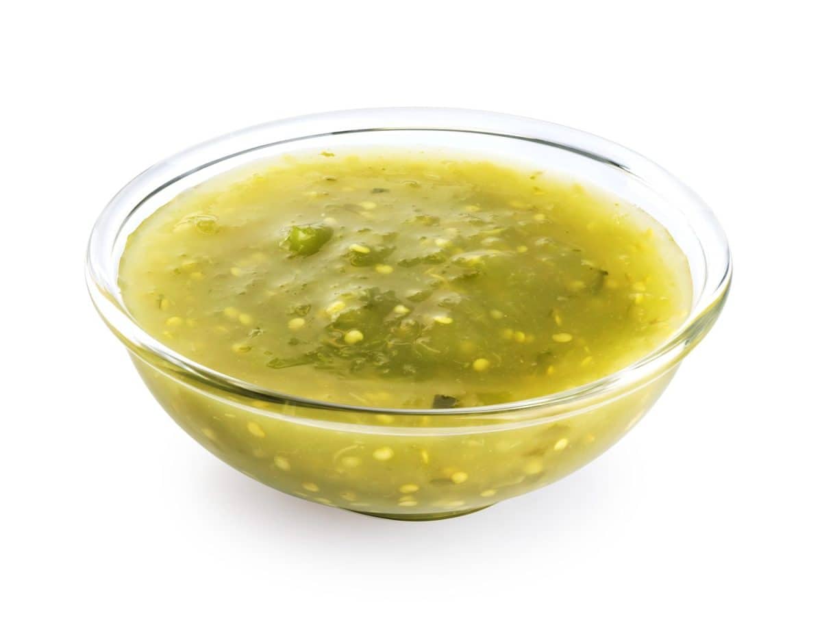 Tomatillo Salsa Verde sauce in a bowl isolated on white background. With clipping path.