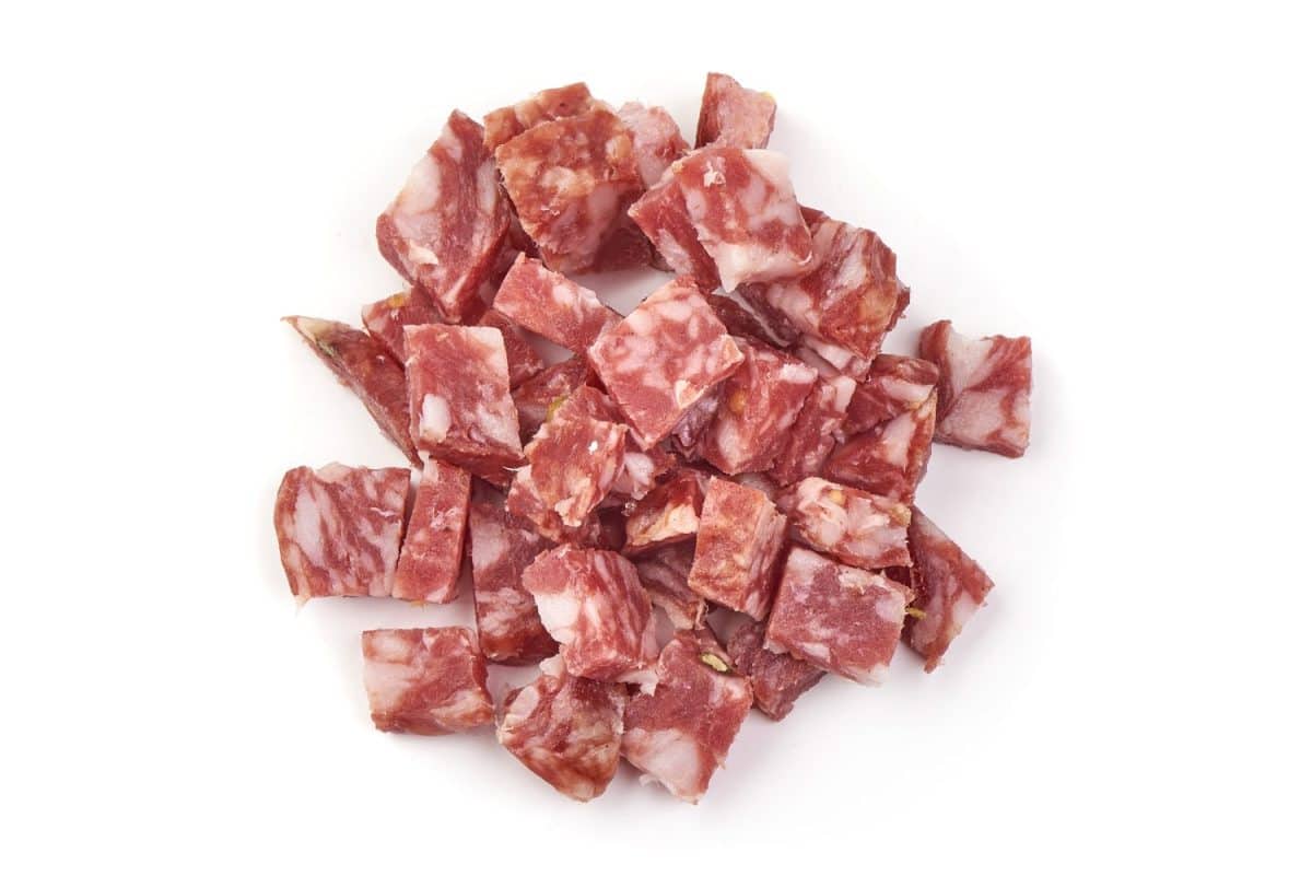 Smoked sausage slices, cut by cubes, ingredients, isolated on white background. I Used to Only Eat Boar's Head Deli Meat, But These 8 Brands Are Just as Good