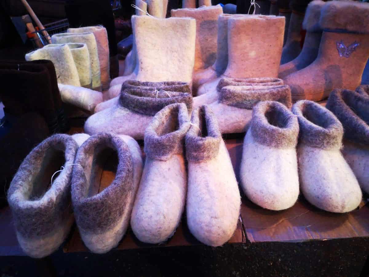 Many children's and adult white winter boots