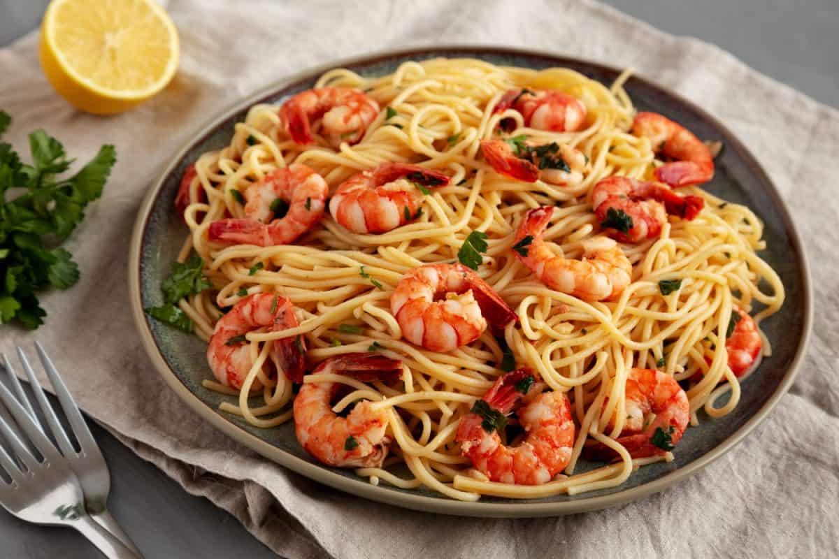 Homemade Cooked Garlic Shrimp Scampi on a Plate, side view.