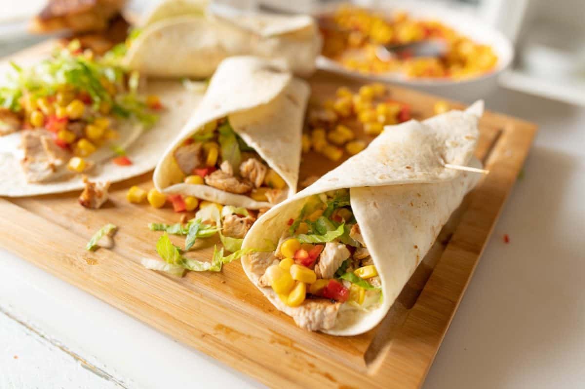 Healthy wraps or tortilla filled with pan fried turkey breast, corn and pepper salsa, sour cream and lettuce. I Used to Only Eat Boar's Head Deli Meat, But These 8 Brands Are Just as Good