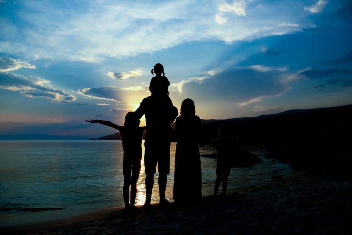 happy family silhouette at greek sea background