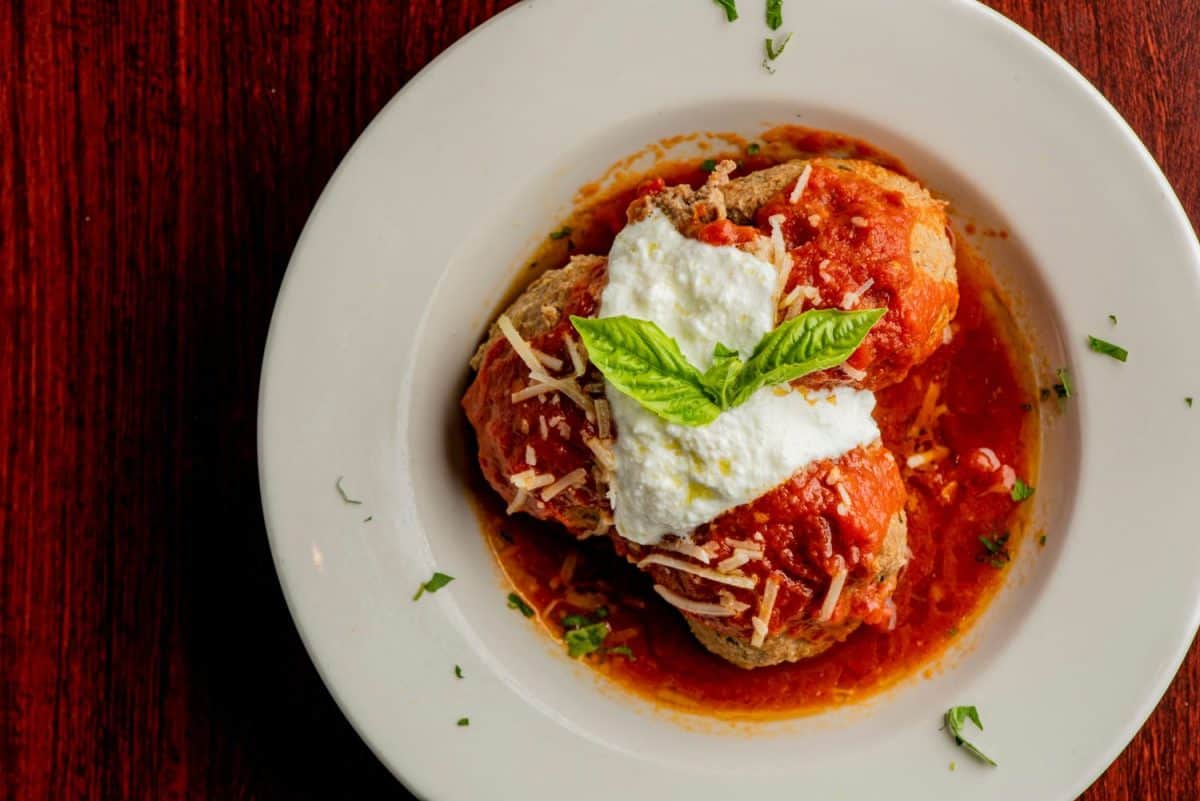 Spaghetti and meatballs. Pasta with homemade meatballs, Parmesan cheese and Italian parsley. Classic American or Italian restaurant favorite. Homemade pasta with tomato sauce, meats and cheeses.