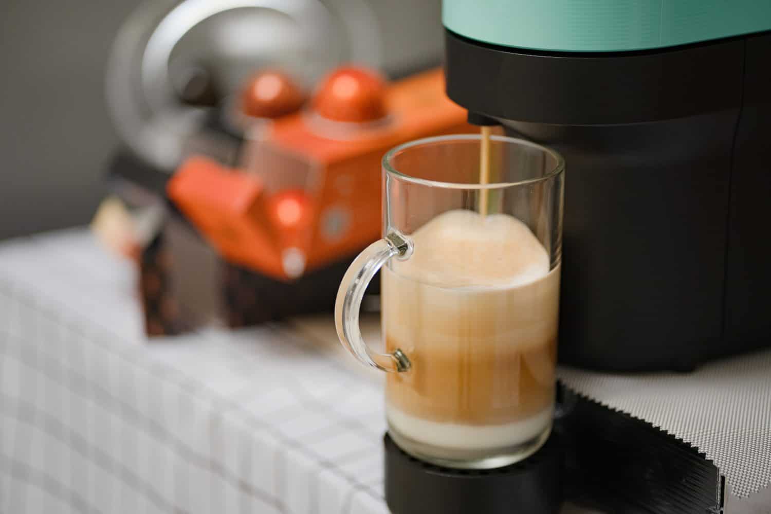 Capsule coffee machine with espresso cup. Nespresso is worldwide leader company with coffee