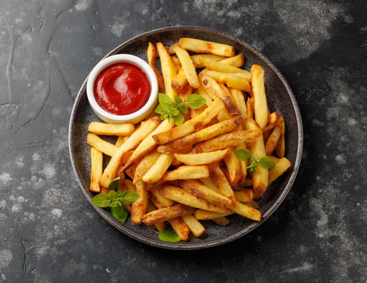 Homemade French fries with ketchup, homemade roasted in the air fryer.