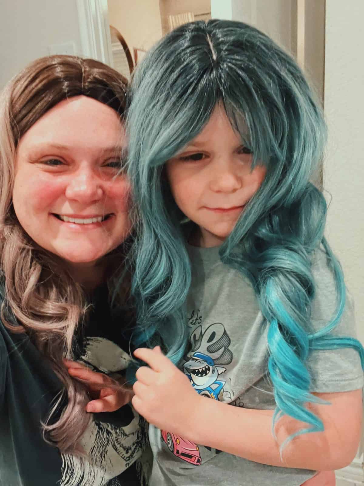 Sydni Ellis and her son wearing wigs.