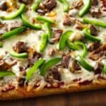 Everyone Will Love This Unique Philly Cheesesteak Pizza Recipe